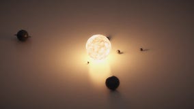 Small solar system on the table. Shining star and planets.