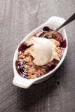 Small white aramekian bowl of boysenberry cobbler stock photos Small white aramekian bowl of boysenberry cobbler stock photos