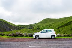 Beautiful Small white car standing by the road side