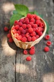 Small wicker basket with fresh ripe raspberries royalty free stock images Small wicker basket with fresh ripe raspberries royalty free stock images