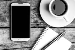 Smartphone With Notebook, Fountain Pen And Cup Of Coffee. Royalty Free Stock Images