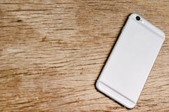 Smartphone on the wooden table royalty free stock photo Smartphone on the wooden table royalty free stock photo
