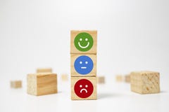 smiley face on wood block cube - business services rating customer experience, Satisfaction survey concept - Feedback royalty free stock image smiley face on wood block cube - business services rating customer experience, Satisfaction survey concept - Feedback royalty free stock image