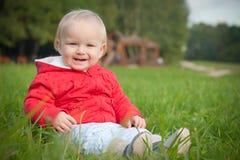 Smiling Baby Sit On Green Grass Stock Photos