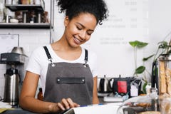 Smiling beautiful waitress using digital tablet Stock Photo Smiling beautiful waitress using digital tablet Stock Photo