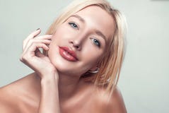smiling beautiful young woman touching skin royalty free stock image smiling beautiful young woman touching skin royalty free stock image