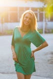 Smiling blond woman in sunlight
