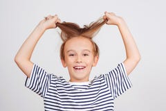 Smiling Boy Posing At Studio. Children Style And Fashion. Happy Boy With Stylish Hairstyle Royalty Free Stock Photography Smiling Boy Posing At Studio. Children Style And Fashion. Happy Boy With Stylish Hairstyle Royalty Free Stock Photography