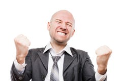 Smiling businessman winner gesturing raised hands fist celebrating victory achievement Stock Photo Smiling businessman winner gesturing raised hands fist celebrating victory achievement Stock Photo
