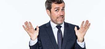 Smiling careless bearded businessman refusing accusation, acting like an hypocrite royalty free stock image Smiling careless bearded businessman refusing accusation, acting like an hypocrite royalty free stock image