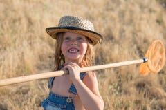 Smiling child with butterfly net stock image Smiling child with butterfly net stock image
