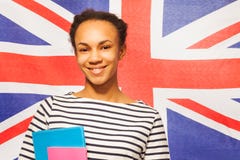 Smiling English student with textbooks royalty free stock photos Smiling English student with textbooks royalty free stock photos