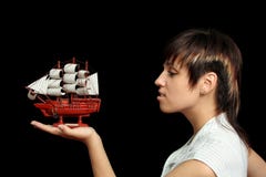 Smiling Girl With The Toy Ship Stock Photo