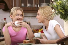 Smiling Girls Have Tea Royalty Free Stock Image Smiling Girls Have Tea Royalty Free Stock Image