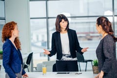 Smiling head of the company speaks about the success of a new business stock image Smiling head of the company speaks about the success of a new business stock image