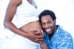 https://thumbs.dreamstime.com/t/smiling-husband-listening-to-his-pregnant-wife-belly-portrait-home-60535027.jpg