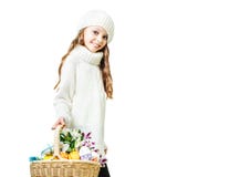 Smiling little girl with basket full of colorful easter eggs stock photography Smiling little girl with basket full of colorful easter eggs stock photography