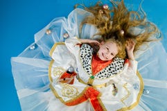 Smiling Little Girl In Royal Clothes Stock Photo