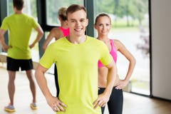 Smiling man and woman exercising in gym royalty free stock photo Smiling man and woman exercising in gym royalty free stock photo