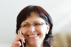 Smiling middle-aged woman call by phone stock images Smiling middle-aged woman call by phone stock images