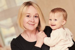 Smiling mother with little baby child royalty free stock photography Smiling mother with little baby child royalty free stock photography