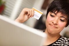 Smiling Multiethnic Woman with Credit Card, Laptop stock photo Smiling Multiethnic Woman with Credit Card, Laptop stock photo
