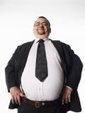 Smiling Overweight Businessman With Hands On Hips Stock Photo