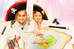 Smiling pirates drawing the map of Treasure Island stock photography Smiling pirates drawing the map of Treasure Island stock photography