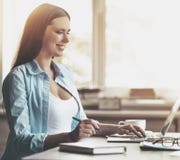 Smiling Pregnant Woman Working with Laptop at Home Royalty Free Stock Images Smiling Pregnant Woman Working with Laptop at Home Royalty Free Stock Images