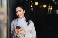 Smiling pretty brunette woman with pony tail having red manicure royalty free stock photo Smiling pretty brunette woman with pony tail having red manicure royalty free stock photo