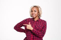 Smiling pretty young african american woman pointing away royalty free stock images Smiling pretty young african american woman pointing away royalty free stock images