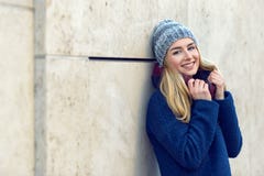 Smiling pretty young woman in a beanie royalty free stock photography Smiling pretty young woman in a beanie royalty free stock photography