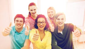 Smiling students at school showing thumbs up stock images Smiling students at school showing thumbs up stock images