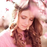 Smiling teenage girl posing in peach garden royalty free stock photos Smiling teenage girl posing in peach garden royalty free stock photos