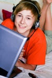 Smiling Teenager With A Laptop Stock Photography