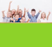 The smiling teenagers showing okay sign on white Stock Image The smiling teenagers showing okay sign on white Stock Image