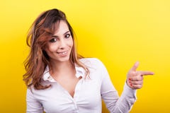 Smiling Woman Pointing At Her Left Stock Images