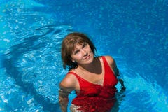 Smiling woman in the pool stock photos Smiling woman in the pool stock photos