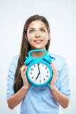 Smiling woman portrait with alarm clock. Isolated portrait stock photography Smiling woman portrait with alarm clock. Isolated portrait stock photography