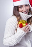 Smiling young Christmas woman with Santa hat stock photos Smiling young Christmas woman with Santa hat stock photos