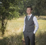 Confident relaxed young man outdoors in suit and tie royalty free stock photography Confident relaxed young man outdoors in suit and tie royalty free stock photography