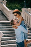 smiling young man holding african american girlfriend stock photo smiling young man holding african american girlfriend stock photo