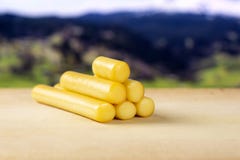 Smoked slovak string cheese stick with alps behind royalty free stock photo Smoked slovak string cheese stick with alps behind royalty free stock photo