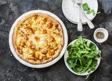 Smoked trout, potatoes, leek pie on dark background, top view royalty free stock photo Smoked trout, potatoes, leek pie on dark background, top view royalty free stock photo