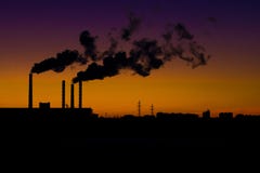 Smoking industrial pipes against the backdrop of the sunset. stock images Smoking industrial pipes against the backdrop of the sunset. stock images