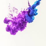 smoky splashes of blue and purple paint in water, isolated on white royalty free stock images smoky splashes of blue and purple paint in water, isolated on white royalty free stock images