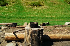 Smoky tourist bowler on a stump in a clearing in the forest, concept of authentic objects in the wild, copy space royalty free stock photo Smoky tourist bowler on a stump in a clearing in the forest, concept of authentic objects in the wild, copy space royalty free stock photo
