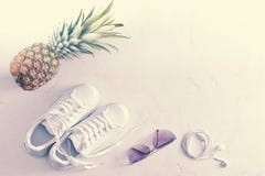 Sneakers, pineapple, sunglasses and headphones royalty free stock image Sneakers, pineapple, sunglasses and headphones royalty free stock image