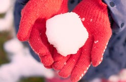 A snow ball in the hands of a child stock photos A snow ball in the hands of a child stock photos