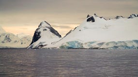 Snow covered mountain landscape in Antarctica around Cuverville Island. Royalty Free Stock Photo Snow covered mountain landscape in Antarctica around Cuverville Island. Royalty Free Stock Photo
